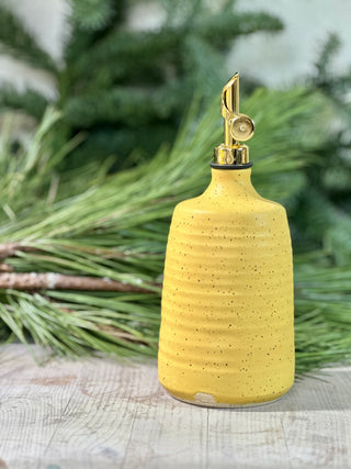 Oil bottle in mustard yellow