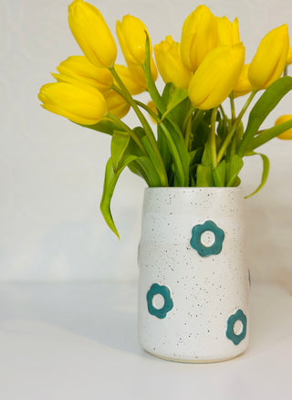 Vase with green flowers