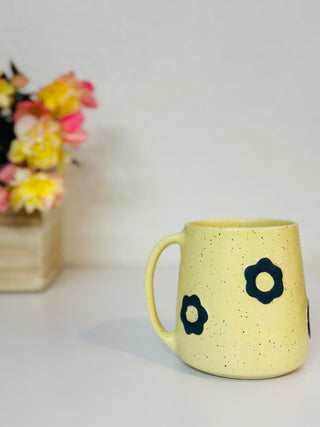 Yellow mug with black flowers